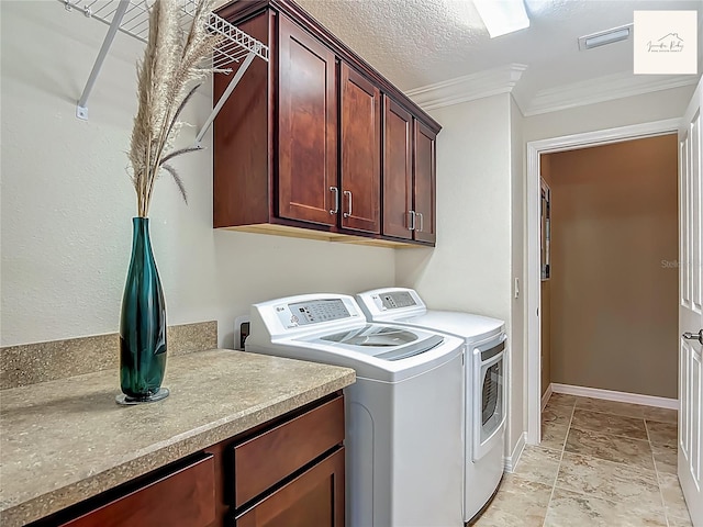 2994 Adrienne Way, The Villages, FL 32163 - laundry area featuring cabinet space, independent washer and dryer, ornamental molding, stone tile flooring, and a textured ceiling