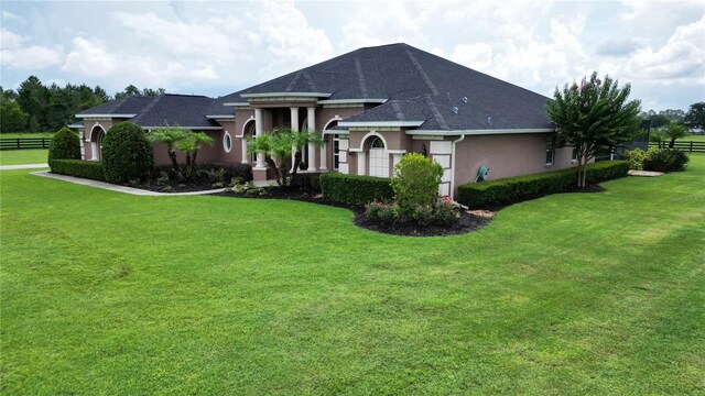 29222 Can Do Ln, Tavares, FL 32778 - view of front of property with stucco siding and roof with shingles