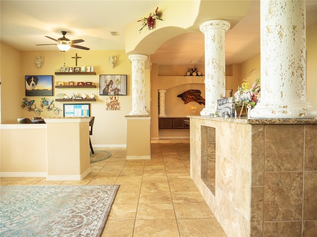 29222 Can Do Ln, Tavares, FL 32778 - kitchen featuring decorative columns, ceiling fan, light tile patterned floors, and arched walkways