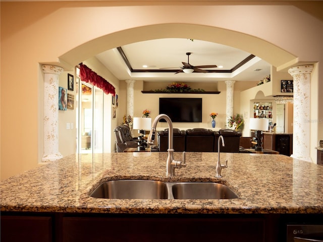 29222 Can Do Ln, Tavares, FL 32778 - kitchen featuring open floor plan, ceiling fan, light stone counters, and a tray ceiling