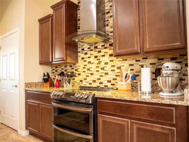 29222 Can Do Ln, Tavares, FL 32778 - kitchen featuring range with two ovens, island exhaust hood, backsplash, and light stone countertops