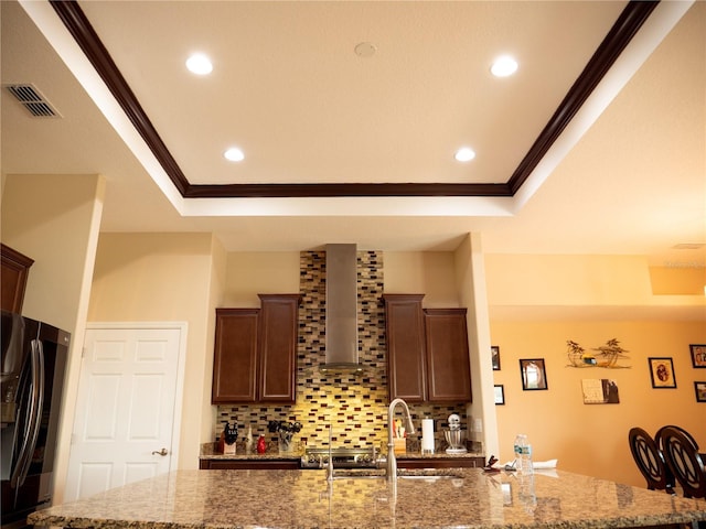 29222 Can Do Ln, Tavares, FL 32778 - kitchen featuring fridge, ornamental molding, decorative backsplash, light stone counters, and recessed lighting