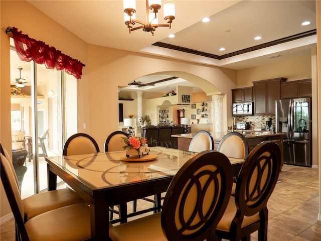 29222 Can Do Ln, Tavares, FL 32778 - dining room featuring decorative columns, arched walkways, ornamental molding, a chandelier, and recessed lighting