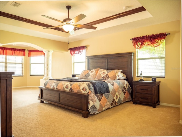 29222 Can Do Ln, Tavares, FL 32778 - carpeted bedroom featuring a raised ceiling, multiple windows, ornamental molding, and a ceiling fan