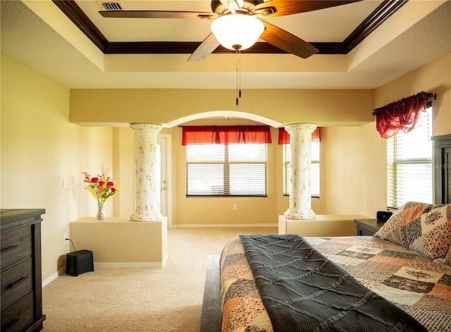 29222 Can Do Ln, Tavares, FL 32778 - carpeted bedroom with ornate columns, crown molding, a tray ceiling, arched walkways, and a ceiling fan