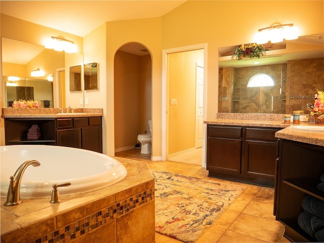 29222 Can Do Ln, Tavares, FL 32778 - full bath with two vanities, a garden tub, and tile patterned floors