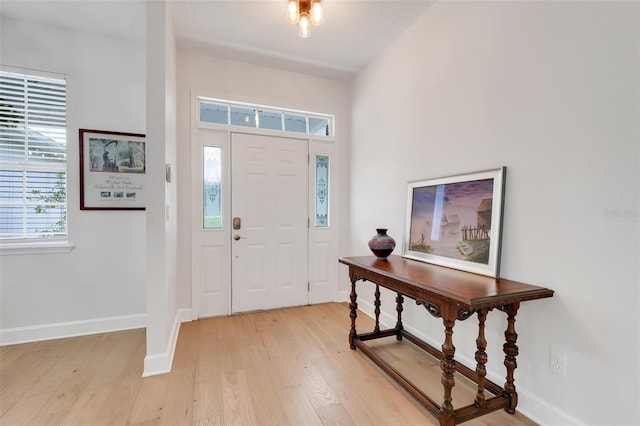 15629 Catherine Cir, Groveland, FL 34736 - entryway with light wood-style flooring and baseboards