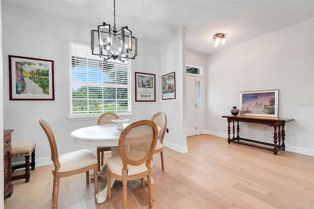 15629 Catherine Cir, Groveland, FL 34736 - dining space with a chandelier and light wood-style floors