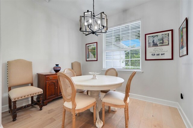 15629 Catherine Cir, Groveland, FL 34736 - dining area featuring a chandelier and light wood-type flooring