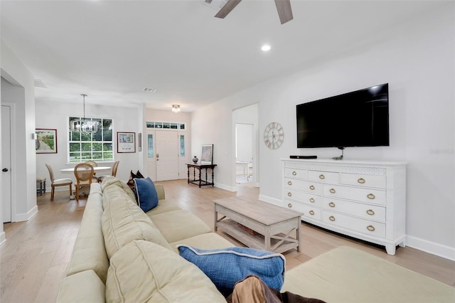 15629 Catherine Cir, Groveland, FL 34736 - living area featuring a ceiling fan, a chandelier, light wood finished floors, and recessed lighting