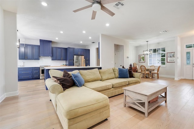 15629 Catherine Cir, Groveland, FL 34736 - living area with light wood-type flooring, a chandelier, a ceiling fan, and recessed lighting