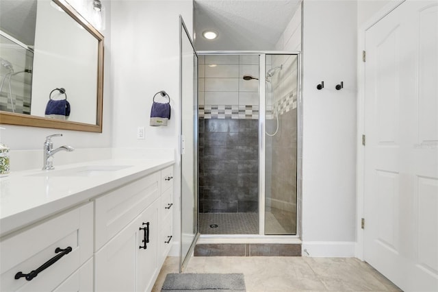 15629 Catherine Cir, Groveland, FL 34736 - bathroom with vanity, a stall shower, recessed lighting, tile patterned floors, and a textured ceiling