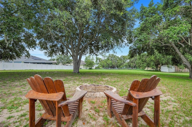15629 Catherine Cir, Groveland, FL 34736 - view of yard with a fire pit and a storage unit