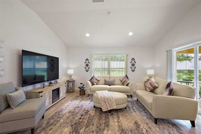 10363 Addison Shore Way, Oxford, FL 34484 - living area featuring wood finished floors, recessed lighting, and high vaulted ceiling