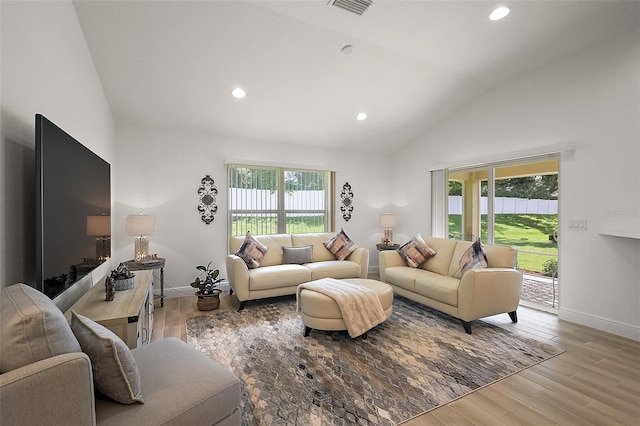 10363 Addison Shore Way, Oxford, FL 34484 - living room featuring recessed lighting, wood finished floors, and high vaulted ceiling