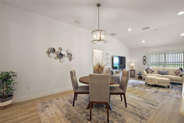 10363 Addison Shore Way, Oxford, FL 34484 - dining room featuring light wood-type flooring, vaulted ceiling, a chandelier, and recessed lighting