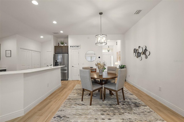 10363 Addison Shore Way, Oxford, FL 34484 - dining area featuring light wood-type flooring, recessed lighting, and a chandelier