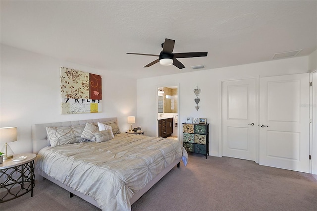 10363 Addison Shore Way, Oxford, FL 34484 - bedroom with carpet flooring, ceiling fan, ensuite bathroom, and attic access