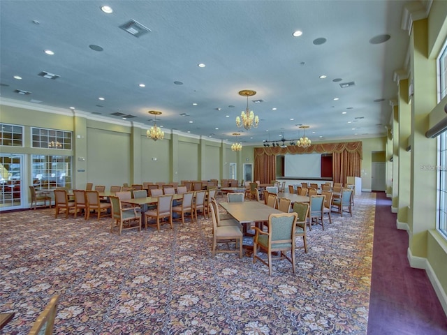 10363 Addison Shore Way, Oxford, FL 34484 - carpeted dining space featuring a chandelier, recessed lighting, and crown molding