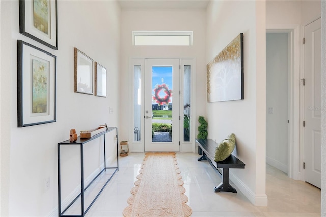 1990 Wallingford Loop, Mount Dora, FL 32757 - foyer featuring light tile patterned flooring and baseboards