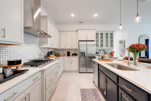 1990 Wallingford Loop, Mount Dora, FL 32757 - kitchen featuring appliances with stainless steel finishes, wall chimney exhaust hood, light countertops, decorative light fixtures, and recessed lighting