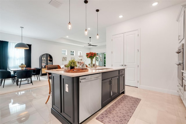 1990 Wallingford Loop, Mount Dora, FL 32757 - kitchen with stainless steel dishwasher, light countertops, recessed lighting, decorative light fixtures, and a kitchen island with sink