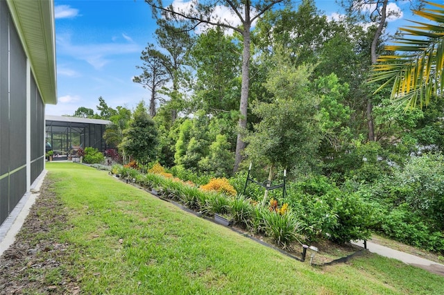 1990 Wallingford Loop, Mount Dora, FL 32757 - view of grassy yard featuring glass enclosure