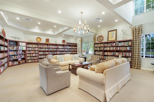 1990 Wallingford Loop, Mount Dora, FL 32757 - carpeted living room with bookshelves, ornamental molding, recessed lighting, and a chandelier