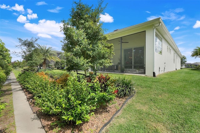 1990 Wallingford Loop, Mount Dora, FL 32757 - view of grassy yard featuring ceiling fan and a sunroom