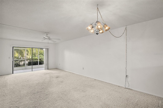 101 N Grandview St Unit 103, Mount Dora, FL 32757 - spare room featuring carpet, a chandelier, a ceiling fan, and a textured ceiling