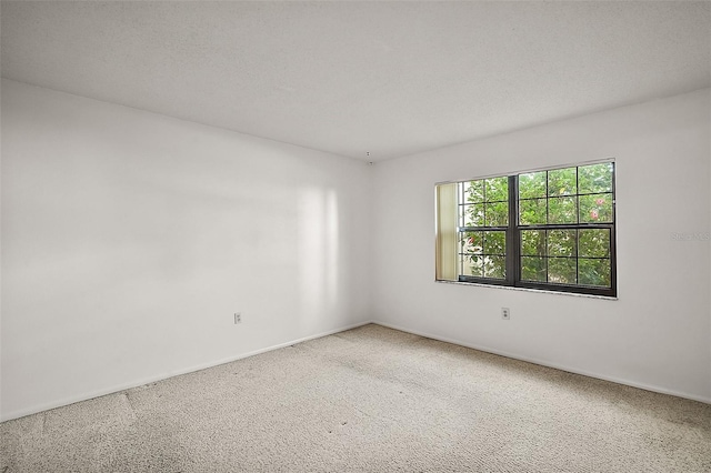 101 N Grandview St Unit 103, Mount Dora, FL 32757 - carpeted spare room featuring baseboards