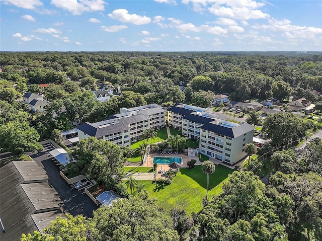 101 N Grandview St Unit 103, Mount Dora, FL 32757 - bird's eye view of a pool area and a forest
