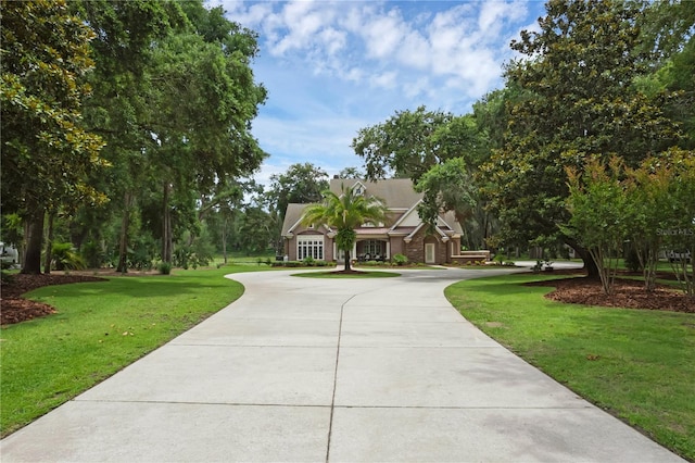 1325 Otters View Ct, Fruitland Park, FL 34731 - surrounding community featuring a lawn and curved driveway