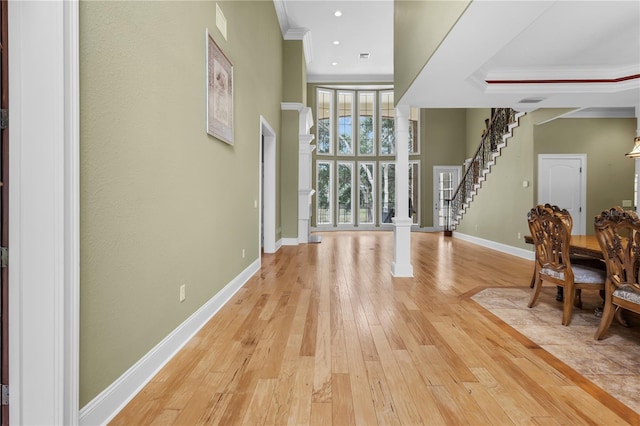 1325 Otters View Ct, Fruitland Park, FL 34731 - foyer with crown molding, light wood-type flooring, decorative columns, stairway, and recessed lighting