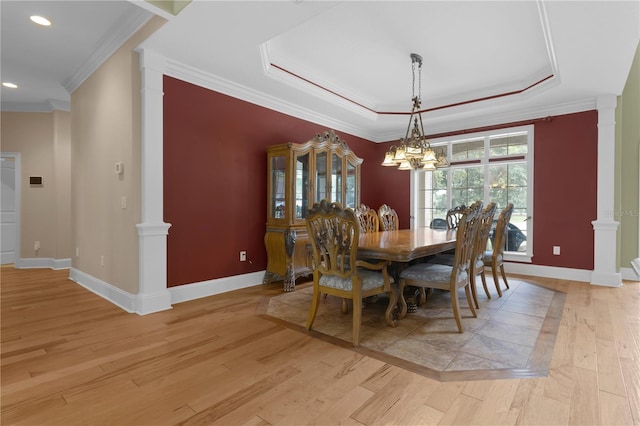 1325 Otters View Ct, Fruitland Park, FL 34731 - dining area with light wood finished floors, ornamental molding, a chandelier, a raised ceiling, and recessed lighting
