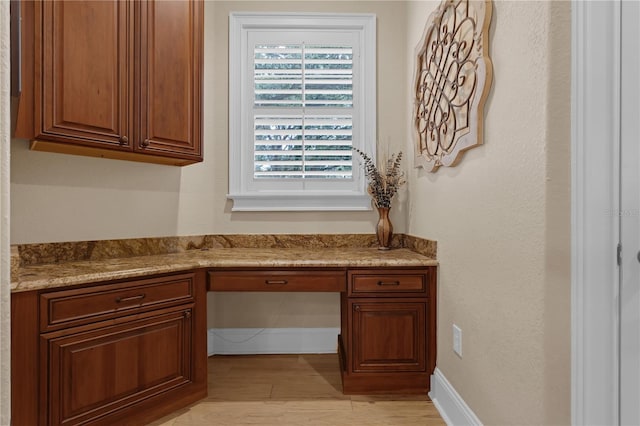 1325 Otters View Ct, Fruitland Park, FL 34731 - unfurnished office with built in study area and light wood-style flooring