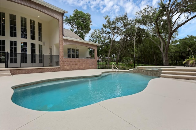 1325 Otters View Ct, Fruitland Park, FL 34731 - view of pool with a patio area and a pool with connected hot tub