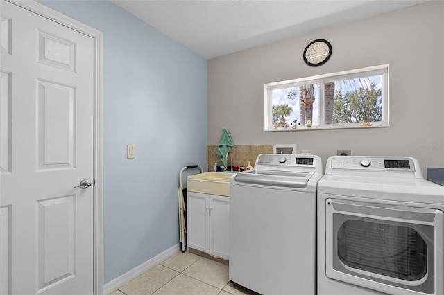 5620 Illumination Ln, Leesburg, FL 34748 - laundry area with cabinet space, washing machine and dryer, and light tile patterned floors