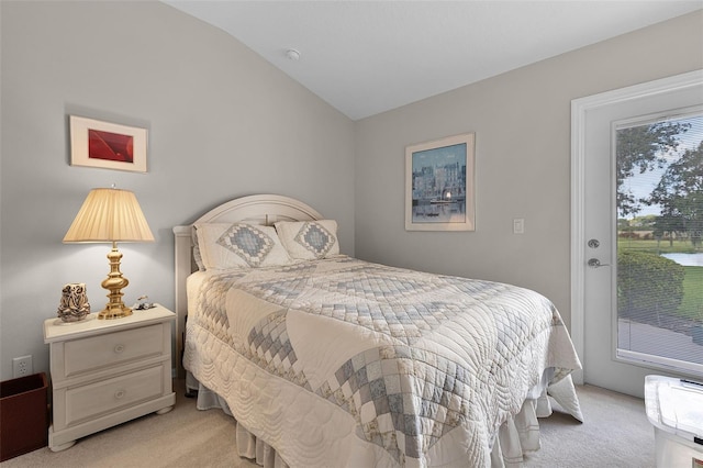 5620 Illumination Ln, Leesburg, FL 34748 - bedroom with light colored carpet, vaulted ceiling, and access to outside