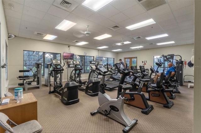 5620 Illumination Ln, Leesburg, FL 34748 - workout area featuring a drop ceiling and carpet