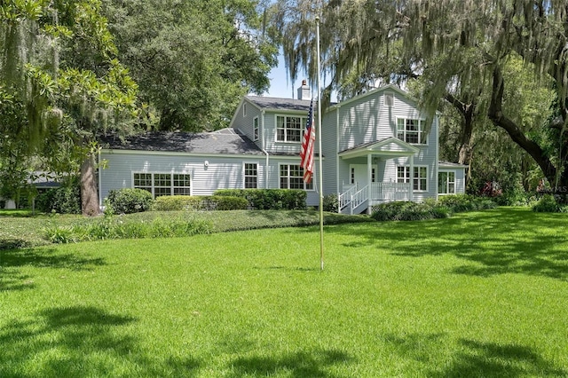 9223 Silver Lake Dr, Leesburg, FL 34788 - back of property featuring a yard and a chimney