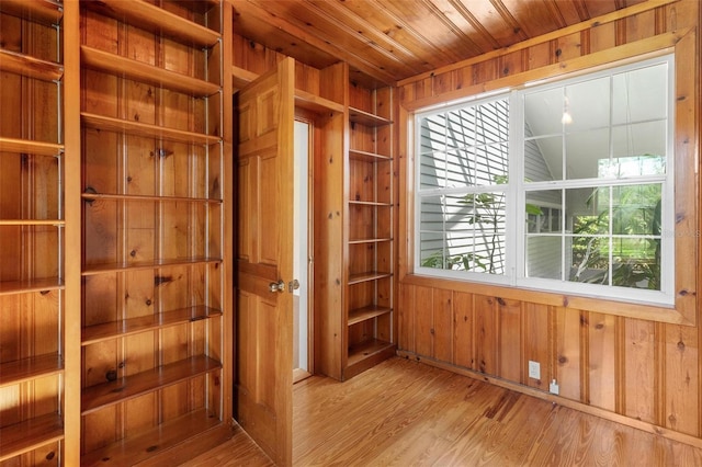 9223 Silver Lake Dr, Leesburg, FL 34788 - empty room featuring wooden walls, wood finished floors, and wooden ceiling