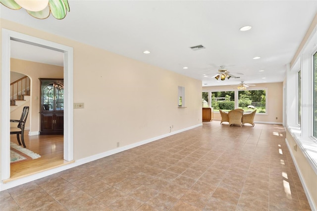9223 Silver Lake Dr, Leesburg, FL 34788 - unfurnished room featuring a ceiling fan, recessed lighting, and stairs