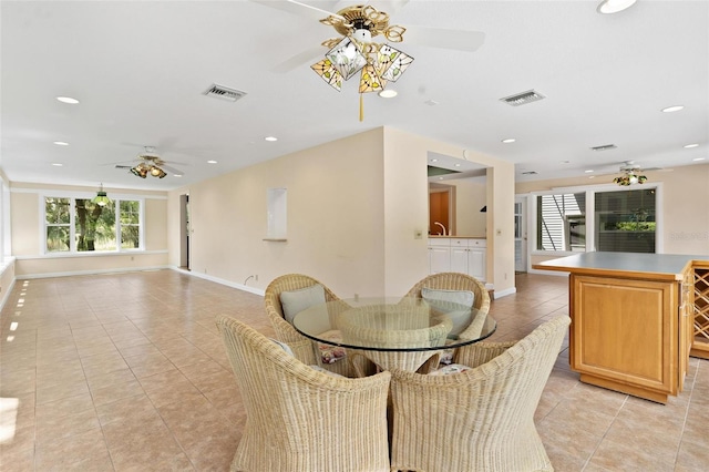 9223 Silver Lake Dr, Leesburg, FL 34788 - dining room featuring a ceiling fan, light tile patterned floors, and recessed lighting