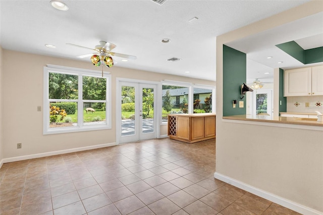 9223 Silver Lake Dr, Leesburg, FL 34788 - unfurnished living room featuring french doors, a ceiling fan, tile patterned floors, and recessed lighting