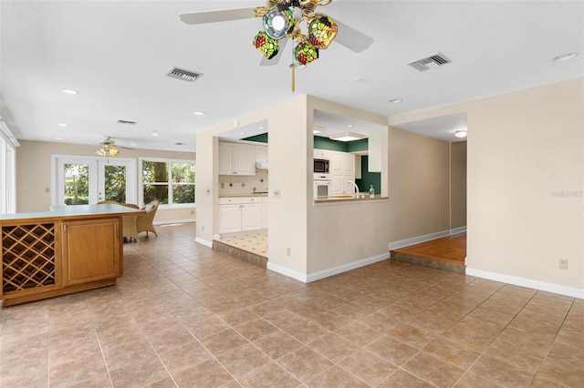 9223 Silver Lake Dr, Leesburg, FL 34788 - living area with a ceiling fan, light tile patterned flooring, and recessed lighting