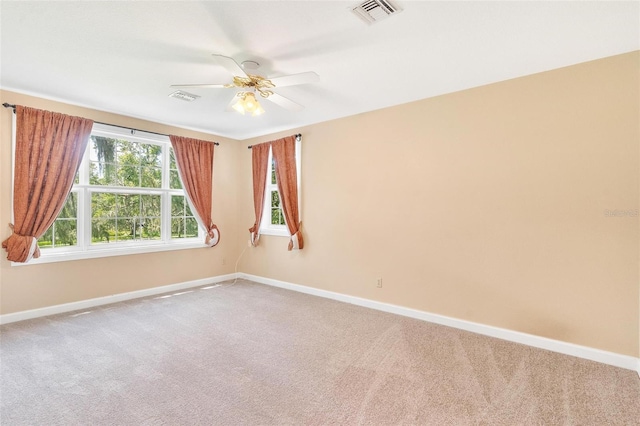 9223 Silver Lake Dr, Leesburg, FL 34788 - spare room featuring carpet flooring and a ceiling fan
