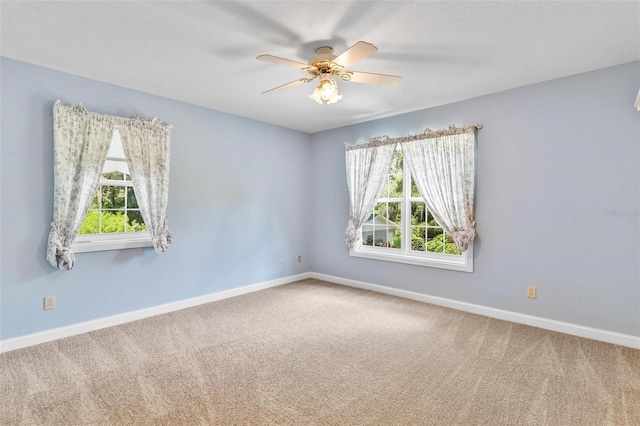 9223 Silver Lake Dr, Leesburg, FL 34788 - carpeted empty room featuring healthy amount of natural light and ceiling fan