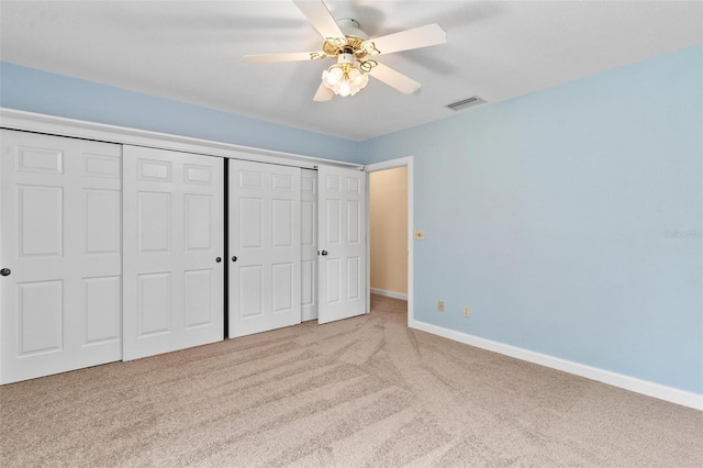 9223 Silver Lake Dr, Leesburg, FL 34788 - unfurnished bedroom with carpet, a closet, and ceiling fan