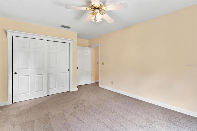 9223 Silver Lake Dr, Leesburg, FL 34788 - unfurnished bedroom with carpet floors, a closet, and a ceiling fan